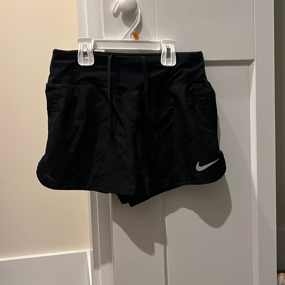 Nike shorts, solid black checkered pattern, size women’s Extra Small